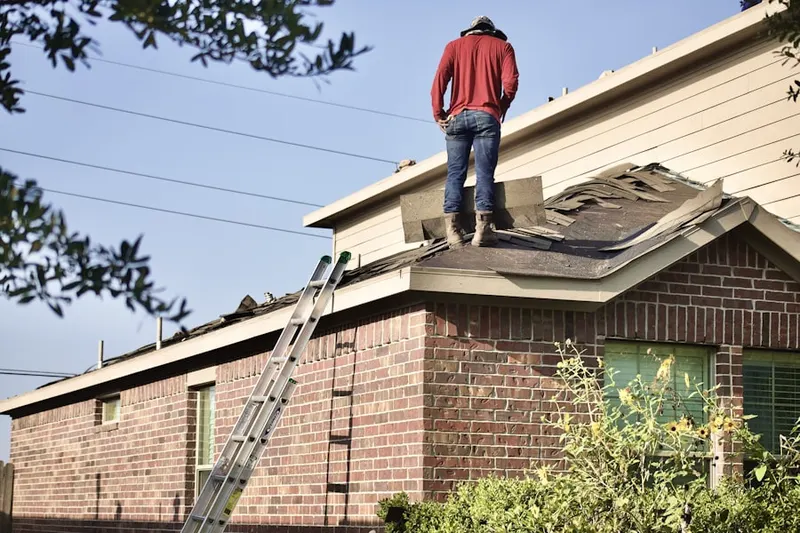 Professional roofer working on a residential roof in Savi Ranch